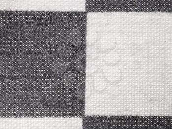 textile background - plaid cotton fabric with Calico weave pattern of threads close up
