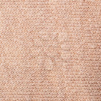 square textile background - pink brown cotton fabric with Jersey (stockinette) Structure weave pattern of threads close up