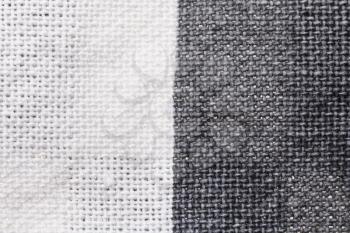textile background - white and gray cotton fabric with Calico weave pattern of threads close up