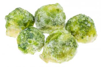 several frozen Brussels sprout cabbageheads isolated on white background