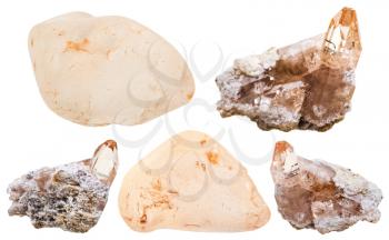 set of natural topaz crystals on rock and polished gem stones isolated on white background