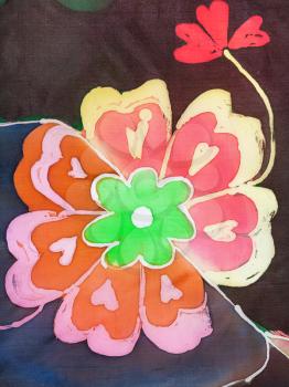 painted flower on silk fabric in the technique of hot batik