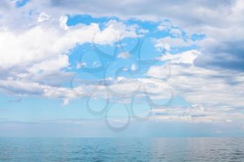 scenery of blue sky with white clouds over calm Sea of Azov, Temryuk bay, Golubitskaya resort, Taman peninsula, Kuban, Russia