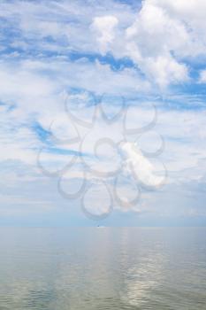 natural background - cumuli white clouds and calm water Sea of Azov, Temryuk bay, Golubitskaya resort, Taman peninsula, Kuban, Russia