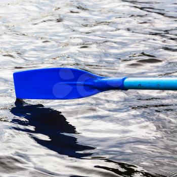paddle over the water during rowing boat on river