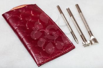 Leathercraft - new handmade leather pouch for spectacle and embossing tools on marble plate