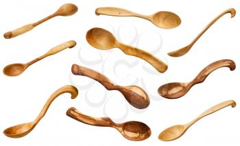 set of wooden spoons carved from various woods isolated on white background