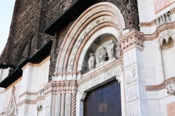 travel to Italy - gate (The Porta Magna with sculpture by Jacopo della Quercia) to Basilica of San Petronio in Bologna city