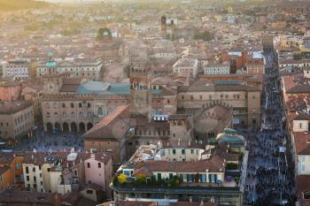 travel to Italy - above view of street with crowd of people and piazza maggiore in Bologna city from Torre Asinelli ( Asinelli Tower) in evening