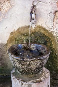 travel to Italy - ancient basin with water on street in Rome city