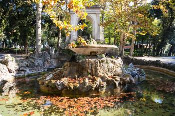 travel to Italy - fountain with fallen leaves in Villa Borghese public gardens in Rome city in autumn