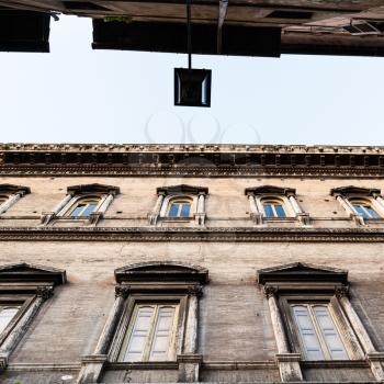 travel to Italy - bottom view of facades of old palaces on narrow street ( Via dei Farnesi) in Rome city