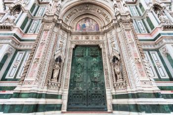 travel to Italy - closed doors of Florence Duomo Cathedral (Cattedrale Santa Maria del Fiore, Duomo di Firenze, Cathedral of Saint Mary of the Flowers) in morning