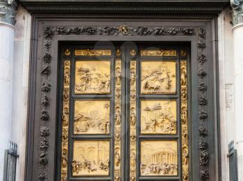 travel to Italy - closed outdoor East doors of Baptistery (Battistero di San Giovanni, Baptistery of Saint John), the doors are copy of Gates of Paradise made by Lorenzo Ghiberti in Florence city