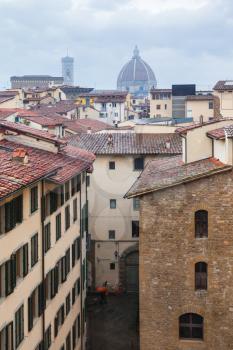travel to Italy - above view of street and old houses in Florence city in rain