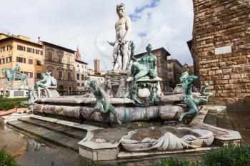travel to Italy - Piazza della Signoria and wet Fountain of Neptune in Florence city in autumn after rain