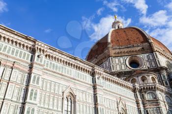 travel to Italy - bottom view of dome of Florence Duomo Cathedral (Cattedrale Santa Maria del Fiore, Duomo di Firenze, Cathedral of Saint Mary of the Flowers) from Piazza del Duomo in Florence city