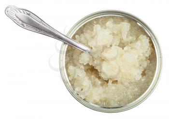top view of open tin with white caviar of halibut fish with spoon isolated on white background