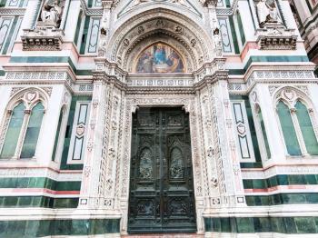 travel to Italy - front view of closed doors of Florence Duomo Cathedral (Cattedrale Santa Maria del Fiore, Duomo di Firenze, Cathedral of Saint Mary of the Flowers) in morning