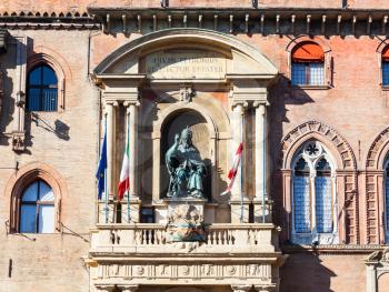 travel to Italy - sculpture of the Bolognese Pope Gregory XIII on facade of palazzo comunale in Bologna city in sunny day