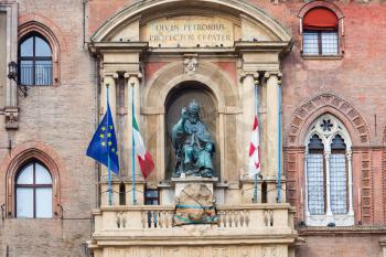 travel to Italy - sculpture of the Bolognese Pope Gregory XIII on facade of palazzo d'accursio (town hall) in Bologna city