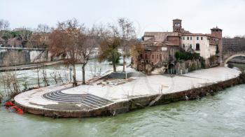 Travel to Italy - view from the south-east on Tiber Island in Rome city in winter