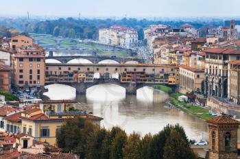 travel to Italy - above view of ponte vecchio (old bridge) in Florence city from Piazzale Michelangelo in autumn evening