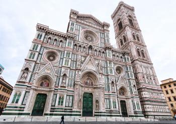 travel to Italy - view of Florence Duomo Cathedral (Cattedrale Santa Maria del Fiore, Duomo di Firenze, Cathedral of Saint Mary of the Flowers) and Giotto's Campanile on Piazza San Giovanni in morning