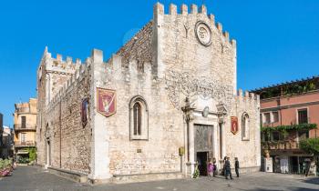 TAORMINA, ITALY - JULY 2, 2011: people near Duomo Catherdal in Taormina city in Sicily. Cathedral of Taormina is a medieval church dedicated to St Nicholas of Bari (San Nicola di Bari)