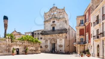 SYRACUSE, ITALY - JULY 3, 2011: visitors near Chiesa di Santa Lucia alla Badia on piazza Duomo in Syracuse in Sicily. The city is a historic town in Sicily, the capital of the province of Syracuse.