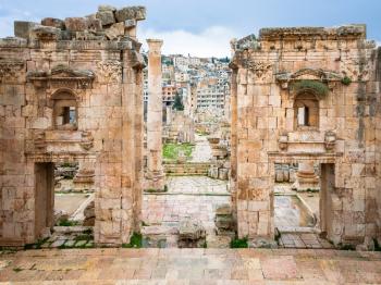Travel to Middle East country Kingdom of Jordan - view of Jerash city through Gateway of Artemis temple in ancient Gerasa town in winter