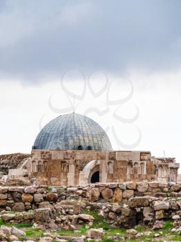 Travel to Middle East country Kingdom of Jordan - ancient Umayyad Palace at Amman Citadel in rainy day in winter