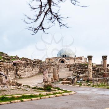 Travel to Middle East country Kingdom of Jordan - view of ancient Umayyad Palace at Amman Citadel in rainy day in winter
