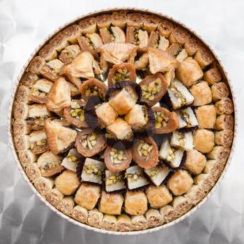 Travel to Middle East country Kingdom of Jordan - many traditional arabian sweet pastry baklava on plate