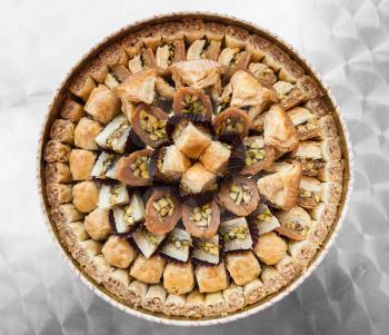 Travel to Middle East country Kingdom of Jordan - top view of many traditional arabian sweet pastry baklava