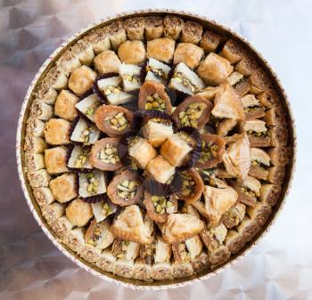 Travel to Middle East country Kingdom of Jordan - above view of various traditional arabian sweet pastry baklava