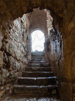 AJLOUN, JORDAN - FEBRUARY 18, 2012: wet stair in medieval Ajlun castle in Jordan in rainy winter day. Ajloun Castle is Muslim castle, it was built in northwestern Jordan in 12th century
