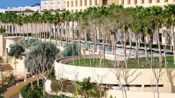 DEAD SEA, JORDAN - FEBRUARY 19, 2012: gardens of Kempinski resort hotel Ishtar on Dead Sea in sunny winter day. It is the largest spa in the region with square 10000 Sqm and best hotel Spa in Jordan