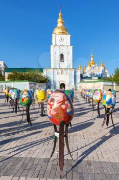 KIEV, UKRAINE - MAY 5, 2017: people and decorated Easter eggs on St Michael's Square near Saint Michael's Golden-Domed Monastery in Kiev city. The monastery was founded in 1108-1113