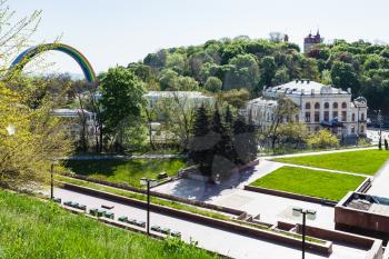 KIEV, UKRAINE - MAY 5, 2017: view of Khreshchaty Park with building of National Philharmonic of Ukraine and People's Friendship Arch in Kiev city from Volodymyrska Hill (Saint Volodymyr Hill) in sprin