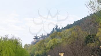 travel to China - view of pagodas in green garden on East Hill of Chinese Buddhist monument Longmen Grottoes in spring season