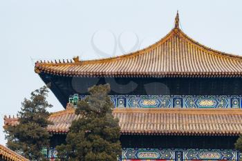 travel to China - decorated roofs of Hall for Worship of Ancestors in Imperial Ancestral Temple (Taimiao) in Beijing Imperial city in spring.