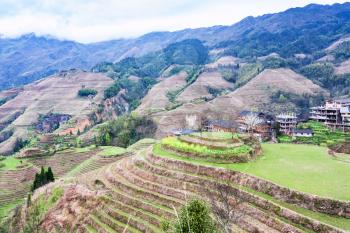 travel to China - view of terraced gardens in Dazhai country from viewpoint Seven Stars Chase The Moon in area Longsheng Rice Terraces (Longji Rice Terraces) in spring