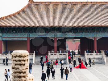 BEIJING, CHINA - MARCH 19, 2017: visitors on court of Imperial Ancestral Temple (Taimiao, Working People's Cultural Palace) in Beijing Imperial city in spring. The first Hall was built in 1420