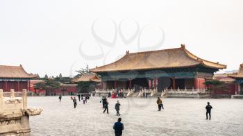 BEIJING, CHINA - MARCH 19, 2017: tourists walk at courtyard of Imperial Ancestral Temple (Taimiao, Working People's Cultural Palace) in Beijing Imperial city. The first Hall was built in 1420