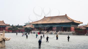 BEIJING, CHINA - MARCH 19, 2017: people walk at courtyard of Imperial Ancestral Temple (Taimiao, Working People's Cultural Palace) in Beijing Imperial city in spring. The first Hall was built in 1420
