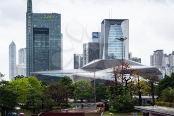 GUANGZHOU, CHINA - MARCH 31, 2017: skyscrapers and Opera House in Zhujiang New Town of Guangzhou city in spring rain. Guangzhou is the third most-populous city in China with population about 13,5 mln