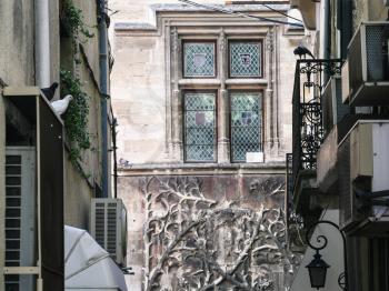 Travel to Provence, France - decorated window in medieval palace in Avignon city