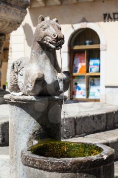 TAORMINA, ITALY - JUNE 29, 2017: detail of fountain (Quattro Fontane di Taormina) on Piazza Del Duomo in summer day. Taormina is resort town on Ionian Sea in Sicily