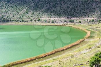 Travel to Turkey - green water of Narligol Crater Lake (Lake Nar) in Geothermal Field in Aksaray Province of Cappadocia in spring
